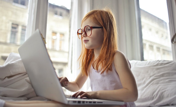 Little girl looking at laptop photo by Andrea Piacquadio from Pexels