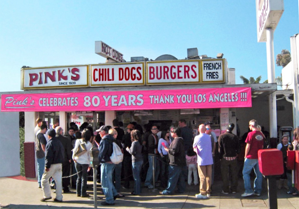 A crowd of people waiting in line in front of Pink's Hot Dogs photo courtesy Pink's Hot Dogs