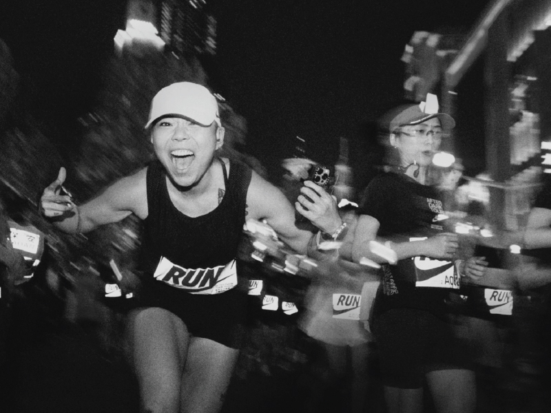 Women running night race Nike After Dark Tour
